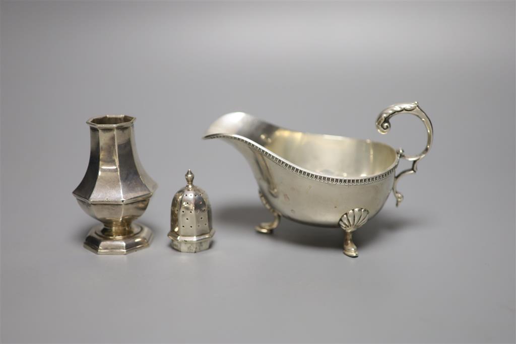 A George V silver sauceboat and an Edwardian silver pepperette, William Hutton & Sons, London, 1905, 11.7cm, 7oz.